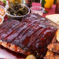 Pork Ribs With 2 Sides · ^ Hour Smoked Pork Ribs comes with 2 sides orders 
Note* side orders change daily. 
mac & Ch...