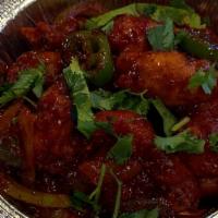 Indian Buffalo Wings · A dozen wings mixed in herbs & spices combined with sweet chilis & a touch of curry flavor.