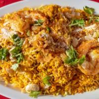 Chef Special Biryani · Basmati rice cooked with lamb, chicken & shrimp topped with fried onions & herbs.