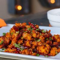 Dry Pepper Dish · Lightly breaded, fried and sautéed with long Hot peppers, sesame seeds and Sichuan peppercor...