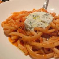 Spaghetti Pomodoro · Plum tomato, basil, parmesan