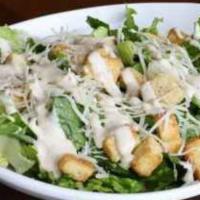 Caesar Salad · Crisp romaine lettuce tossed with homestyle croutons, grated Parmesan cheese and Caesar dres...