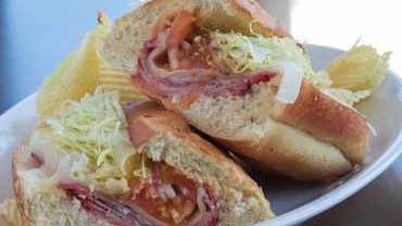 Hot Italian Sub · A meat-packed sub filled with capicola ham, Genoa salami, provolone cheese and Italian dressing. Served cold
upon request.