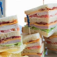 Avenel Player'S Club · A triple decker sandwich stacked with ham, roasted turkey breast, bacon, lettuce, tomato and...