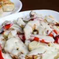 Grilled Chicken Alfredo · Penne pasta with grilled marinated chicken breast, roasted red peppers and artichoke hearts ...