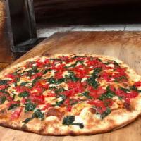 Our Specialty Pie · White with spinach and chopped tomatoes.