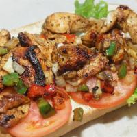 Chicken Cheese Steak · Grilled chicken cheese steak with cheese, grilled onions, peppers, mushroom, and mayo, lettu...