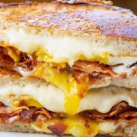 Grilled Crack · fried egg, 2x bacon, american, cheddar and gruyere on buttered sourdough