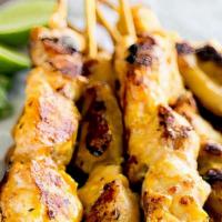 Satay · Charcoal grilled marinated chicken on skewers served with peanut sauce and cucumber relish