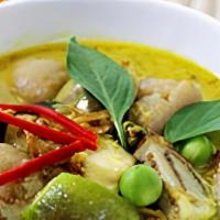 Green Curry · Choice of meat in a green curry with eggplants, bamboo shoots, bell peppers, and basil leaves.