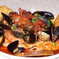 Zuppa Di Mare · Crabmeat, clams, shrimp, mussels, and flounder in a marinara or white wine sauce over lingui...