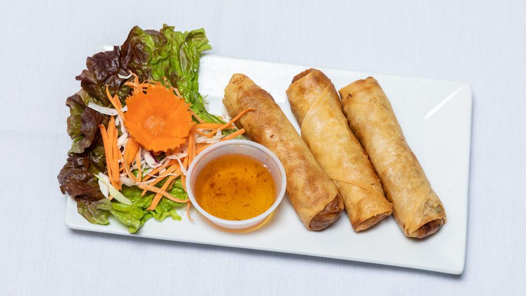 Crispy Spring Roll · Favorite. Golden brown egg roll stuffed with sliced vegetables and chicken served with sweet and sour sauce.