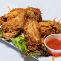 Thai Wings · Crispy wings served with sweet chili sauce.