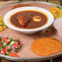 Doro Wot · Traditional dish chicken stew simmered in berbere sauce herbal butter and boiled egg served ...