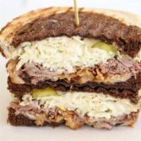 The Lower East Side · Roast beef, swiss cheese, horseradish cream slaw, fried shallots, dill pickle chips, marbled...