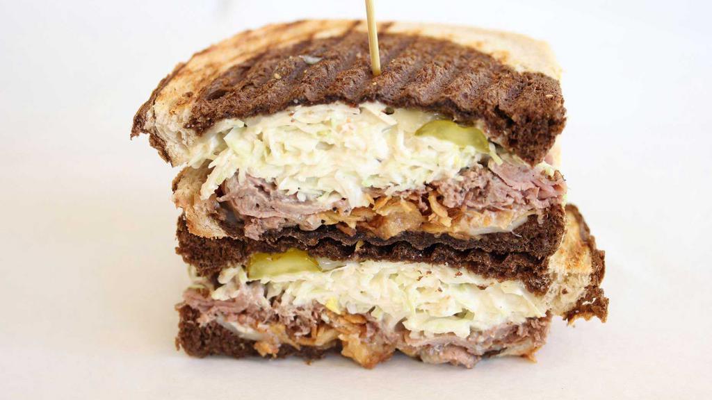 The Lower East Side · Roast beef, swiss cheese, horseradish cream slaw, fried shallots, dill pickle chips, marbled european rye