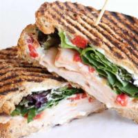 The Delovely · Smoked turkey breast, VT goat cheese, apricot preserves, sweet roasted red peppers, baby gre...