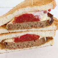The Loaf · Meatloaf stuffed with stewed tomatoes, roasted garlic, Italian herbs, mozzarella, sour dough