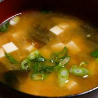 Miso Soup · Authentically prepared using premium miso paste, kombu seaweed, tofu, enoki mushrooms, scall...