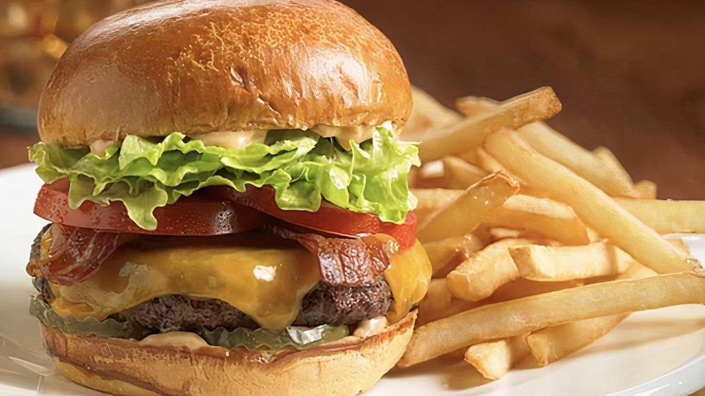 Hamburger Deluxe · Served with lettuce, tomatoes, cole slaw and fries.