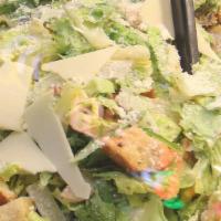 Caesar Salad · Romaine lettuce, croutons, asiago cheese & homemade Caesar dressing.