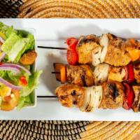 Chicken Kabob · Three grilled chicken skewers with bell peppers and onions.