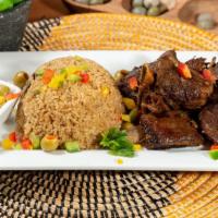 Thiebou-Yap (Che-Bu-Yap) · Senegalese national dish known as jollof rice; beef marinated with Senegalese herbs and spic...