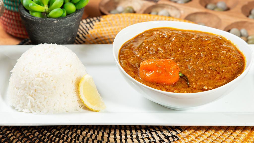 Soup Kandja (Okra Stew) · Stew of finely chopped okra, seafood, and habanero pepper cooked in palm oil and served with white rice.