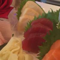 Sashimi Deluxe · Six kinds of raw fish filet. Served with choice of miso soup or green salad.