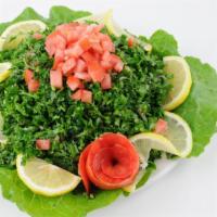 Tabouli · Vegetarian. Fresh chopped parsley, bulgur, tomatoes and onions mixed with olive oil, lemon j...