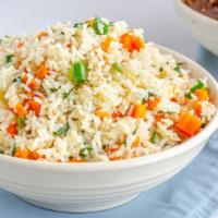 Vegetable Fried Rice · Aromatic steamed rice that is stir-fried with soy sauce, egg, chopped meat, and vegetables.