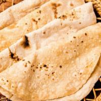 Whole Wheat Roti · Freshly prepared traditional baked whole wheat bread.