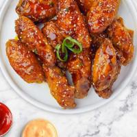 Hot Hot Wings · Fresh chicken wings breaded, fried until golden brown, and tossed in Hot Sauce. Served with ...