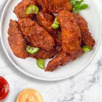 Mild Mild Wings · Fresh chicken wings breaded, fried until golden brown, and tossed in Mild Hot Sauce. Served ...
