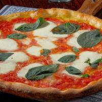 Traditional Margherita Pizza (Small) · Fresh homemade mozzarella and San Marzano tomatoes.