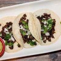 Mexican Street Tacos · 3 Tacos choice of grilled steak, chicken, chorizo, al pastor, cauliflower, garnished with di...