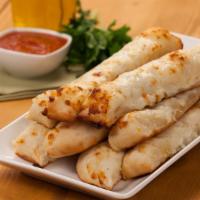 Cheese Breadsticks · Eight sticks topped with garlic butter, three cheeses and served with marinara or garlic sau...