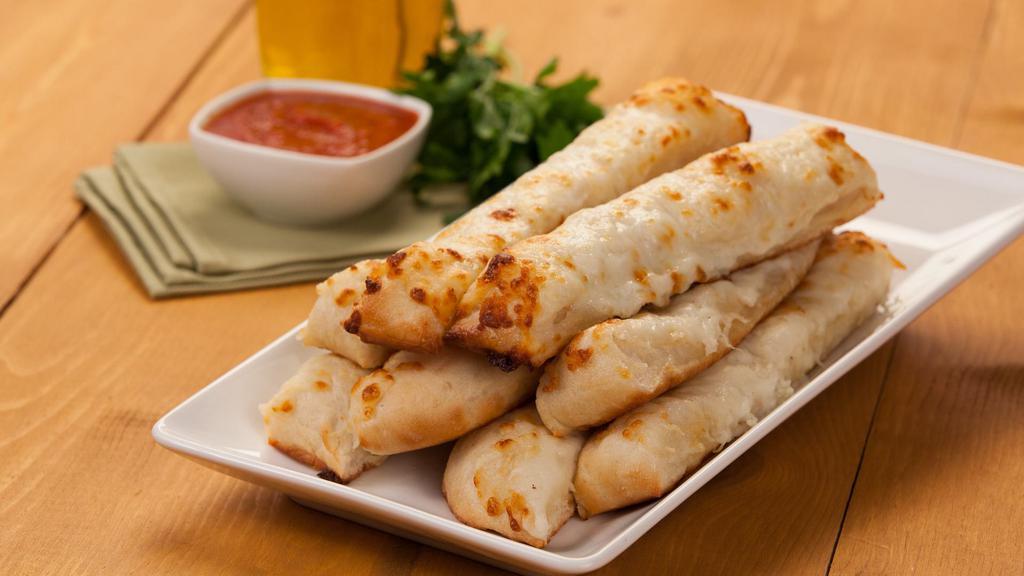 Cheese Breadsticks · Eight sticks topped with garlic butter, three cheeses and served with marinara or garlic sauce. 214 cal per stick.