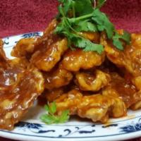 Sweet And Sour Pork / 锅包肉 · Fried Pork coated with Special Sweet & Sour Sauce.