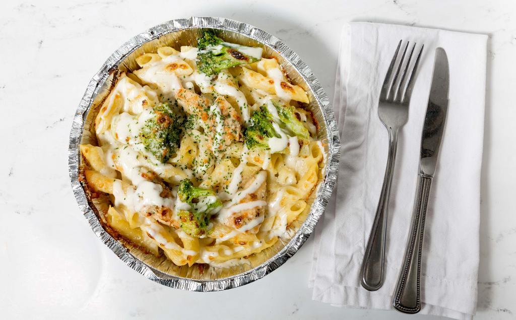 Fettuccine Alfredo With Chicken And Broccoli · Served with garlic bread.