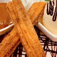 Churros · Made fresh to order, cooked until golden brown with dulche de leche dip.