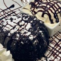 Lava Cake · Our moist dark chocolate cake enrobed with dark chocolate... filled with a dark chocolate tr...