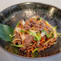 Bulgogi (Traditional Korean Dish) · Thinly sliced cut of marinated beef, stir-fried with scallion and onions, served with white ...