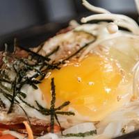 Stone Pot Bibimbap · Assorted vegetables, cooked beef and fried egg served over a bed of rice, served with a side...
