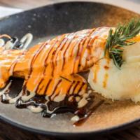 Grilled Salmon With Garlic Yuca Mash · With chinola (passion fruit) creamy sauce