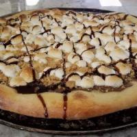 Smores Pizza · Chocolate chips sprinkled on pizza topped with baked marshmallow & sprinkled graham cracker.