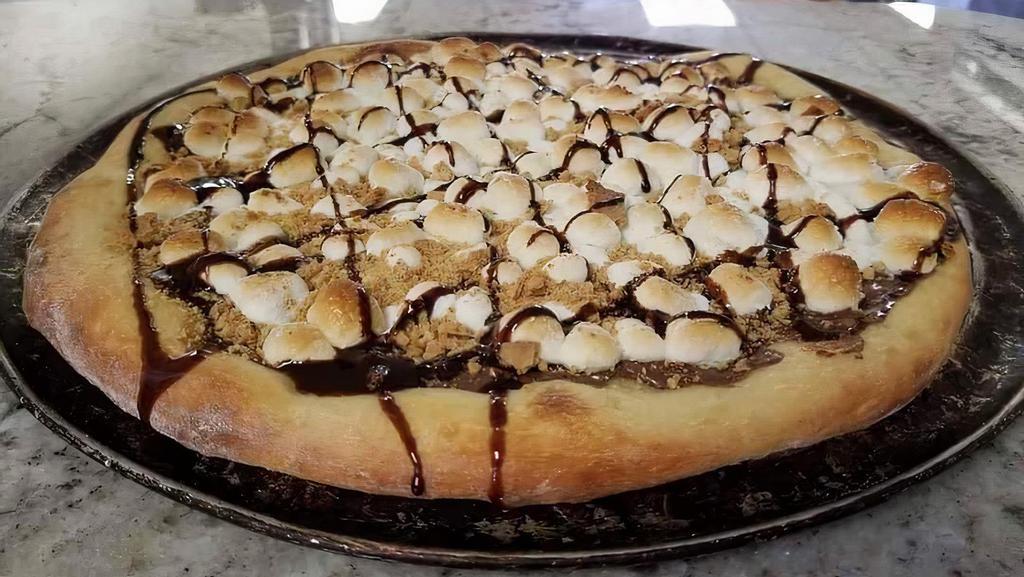 Smores Pizza · Chocolate chips sprinkled on pizza topped with baked marshmallow & sprinkled graham cracker.
