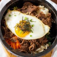 Beef Okdol Bibimbab · Bibimbap served in Hot Stone bowl that gives a toasty flavor.