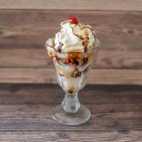 Reese'S Pieces Sundae · Chocolate syrup, peanut butter, and Reese pieces.