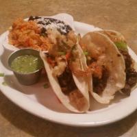 Steak Tacos · Three corn tortillas, grilled sirloin steak and onions, chopped cilantro, lime, roasted toma...